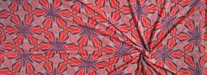 Psychedelic floral pattern in red orange and blue.